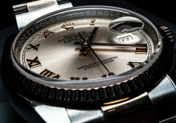 Close-Up Photo of Rolex Round Analog Watch