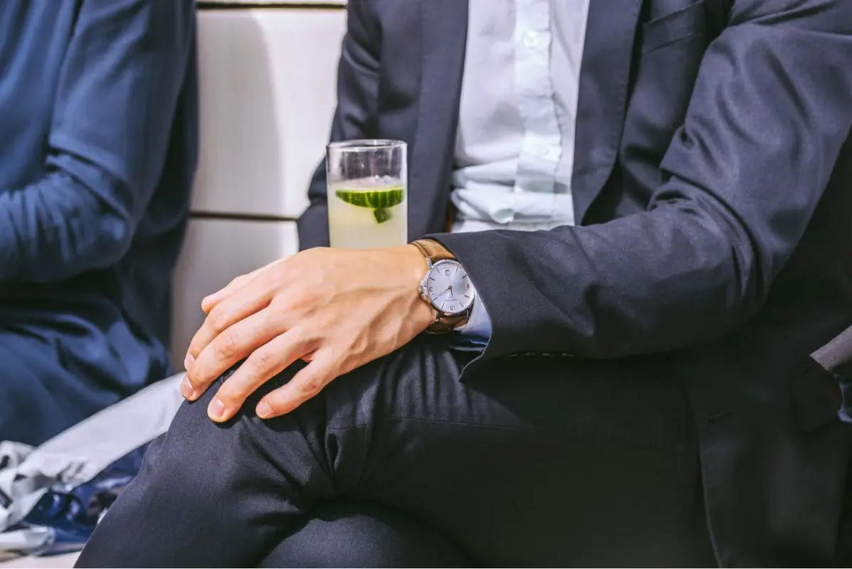 Man in business suit wearing a luxury watch