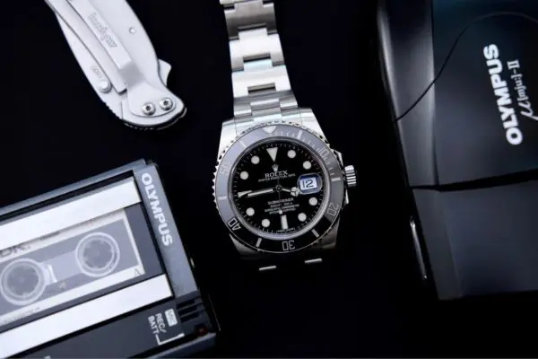 Rolex Submariner watch and Olympus gadgets